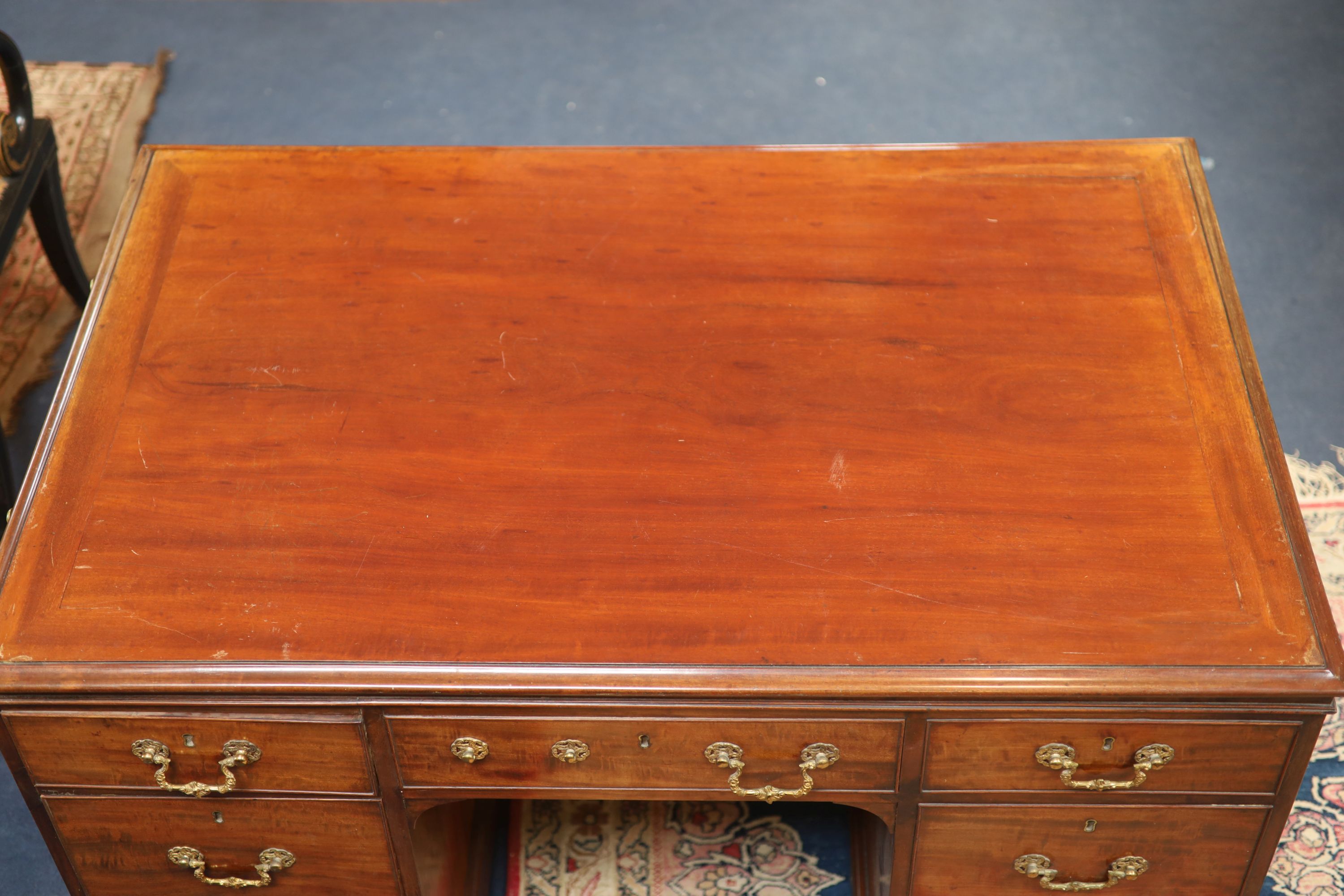 A George IV mahogany kneehole desk by William Williamson & Son of Guildford, second quarter 19th century width 125cm depth 79cm height